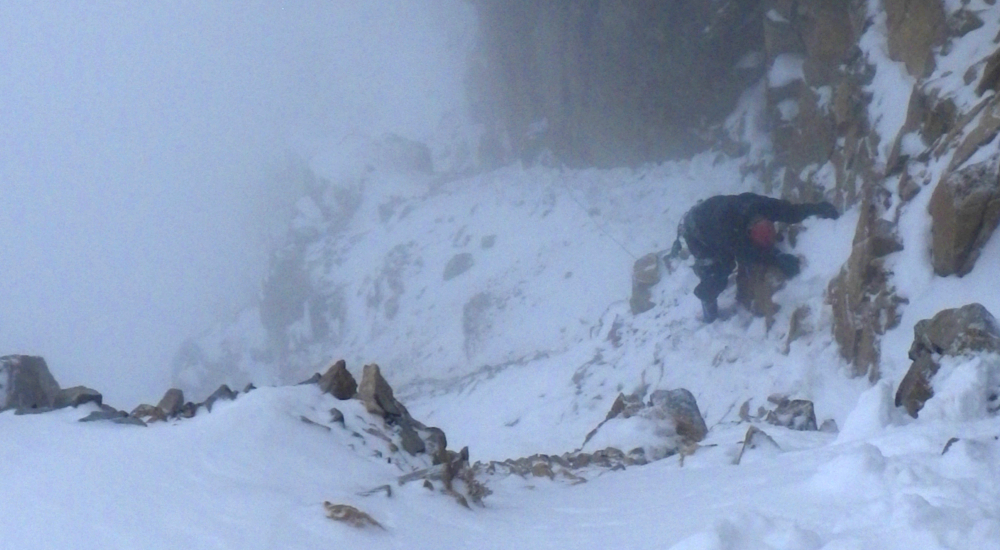 Climbing mixed snow and rock terrain in Baker Basin
