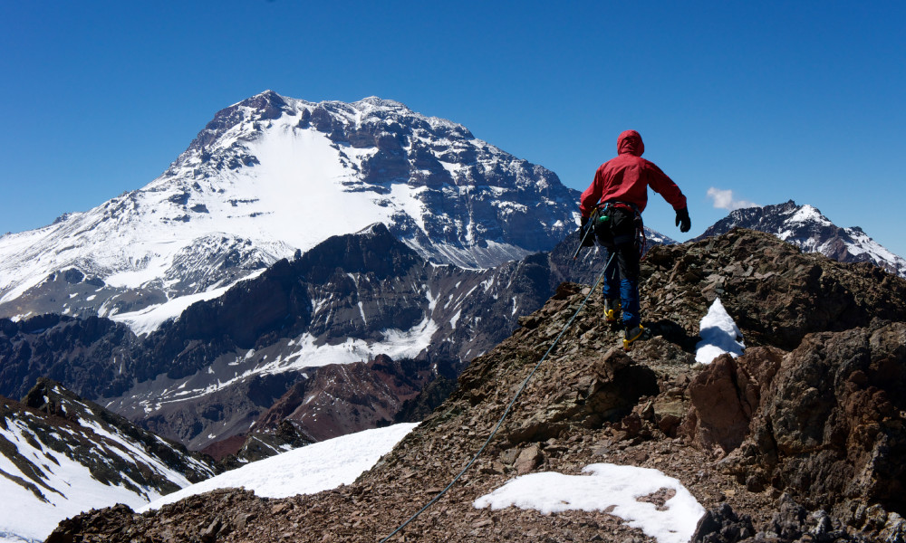Student leads the group to the summit with Aconcagua in the background