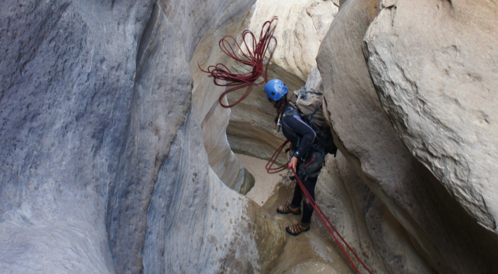 Setting up a rappel in a more technical slot canyon