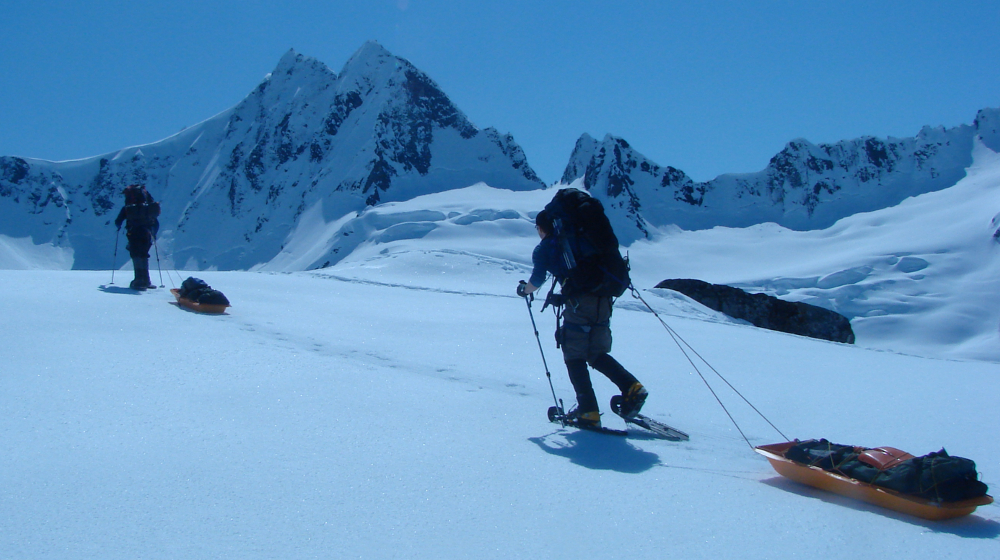 Hauling sleds on a move to high camp above the Garrison Glacier