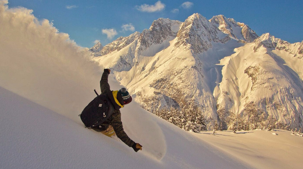 Afternoon light and a boarder's delight dropping into fresh powder