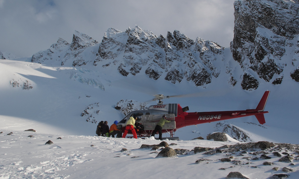 Students loading the helicopter at a PZ near Skagway, Alaska